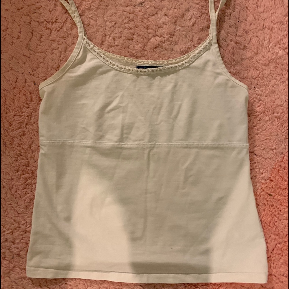 cream tank top with crochet detailing on the top